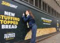 *** FREE FOR EDITORIAL USE ***
Subway rolls out a giant scented billboard in Blackfriars, London, to celebrate the launch of its new sage & onion stuffing-topped bread this festive season – as research reveals the best smells of Christmas. Credit: PinPep/Subway. Immediate release 00:01 9th December 2025.